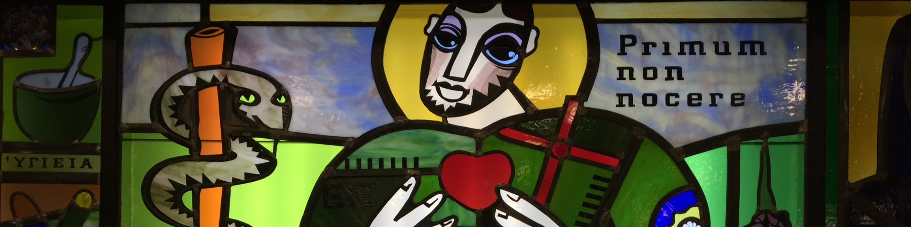 Stained glass window of St. Luke at Loyola Chicago's Stritch School of Medicine.